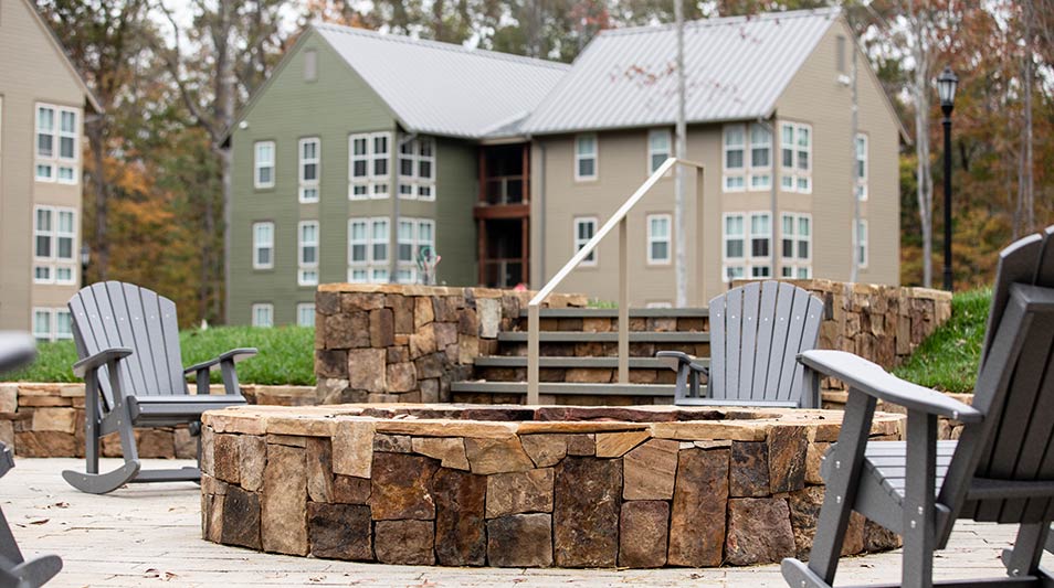 The Grove residence halls exterior featuring the firepit