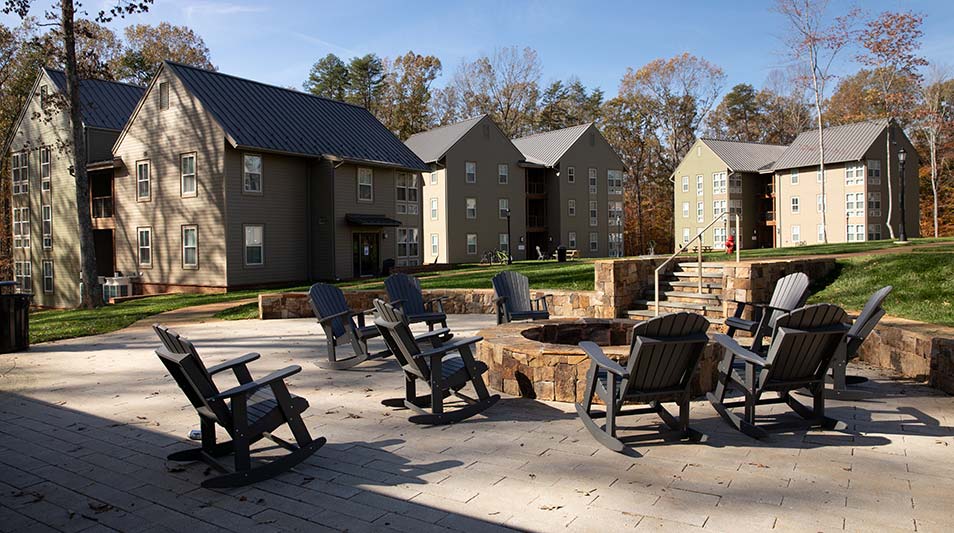 The Grove residence halls exterior featuring the firepit