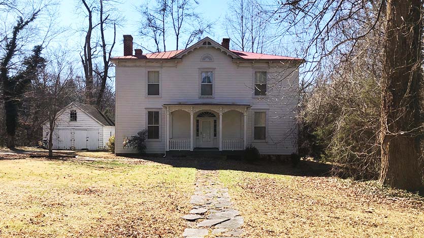 Morrison home is a two-story turn of the century white sided house