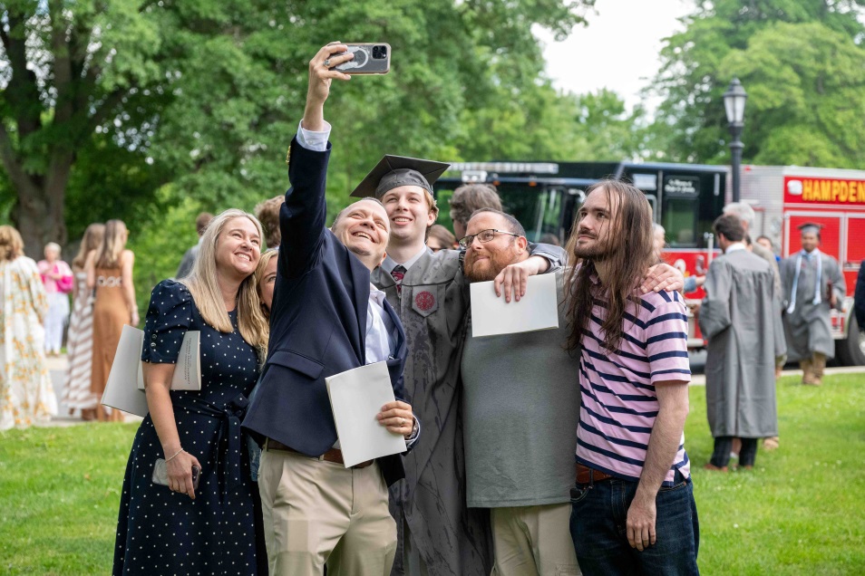 family taking a selfe at commencement