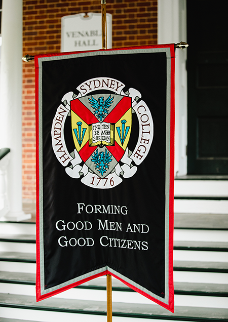 the Hampden-Sydney banner and shield atop a black hanging banner