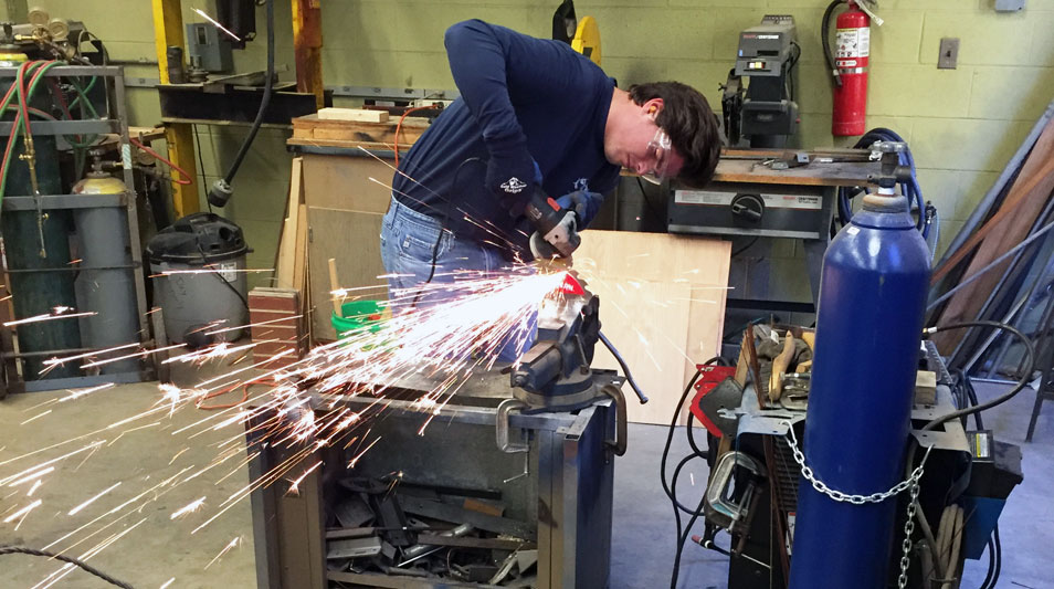 a student making a Yupik upi knife