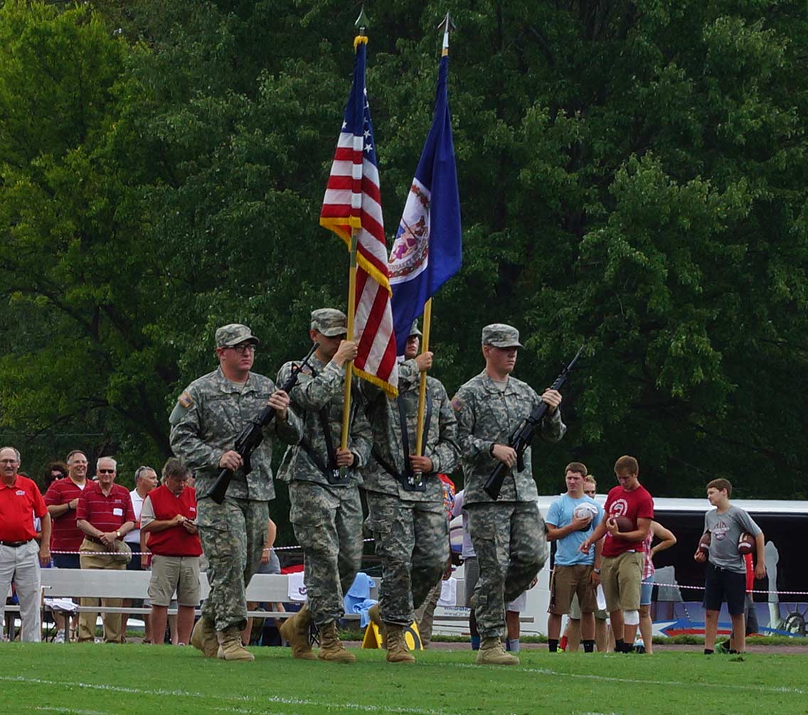 ROTC battalion processing with the flag