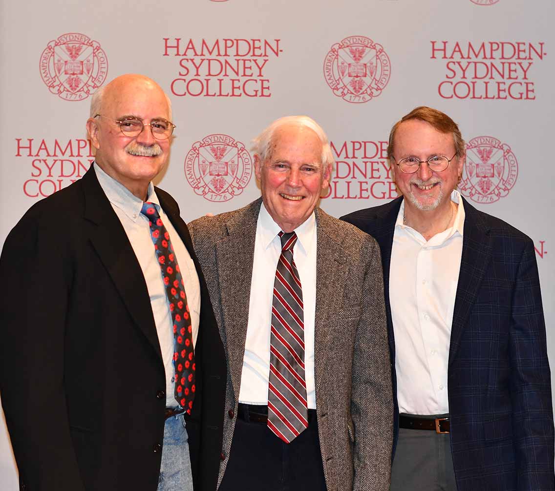 Woodley, Grogan, and Heinemann stand for a photo