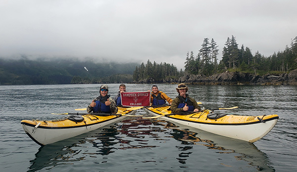 Hampden-Sydney students stopping to pose for a photo while kayaking in Alaska