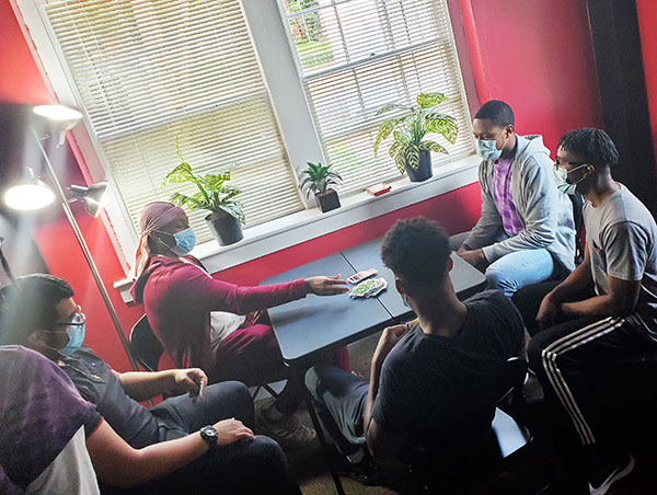 students playing cards in the DEI Lounge