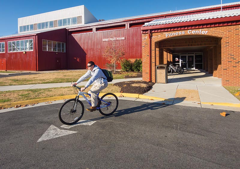 Kirby Fieldhouse with a biker riding by