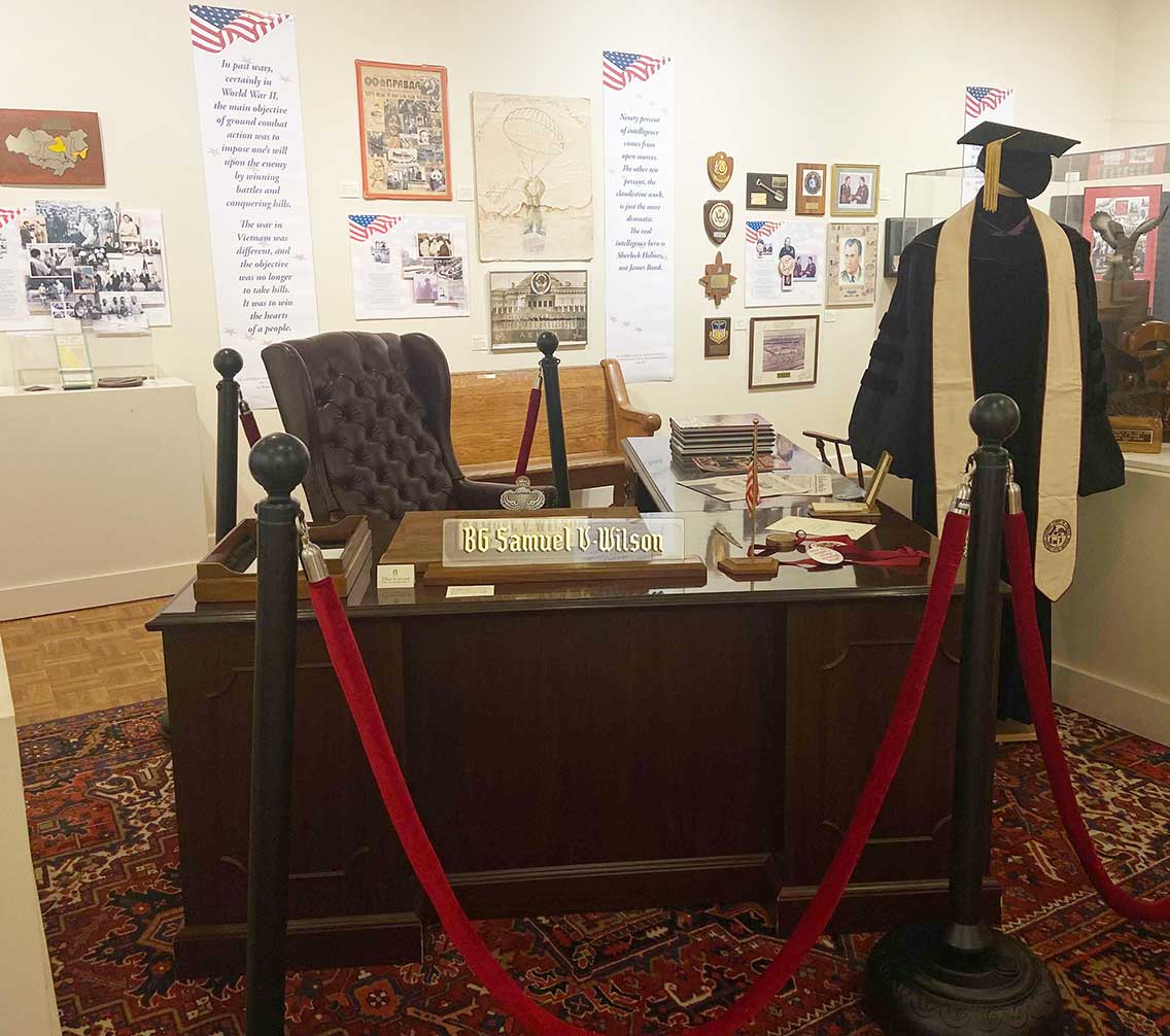 a display of Samuel Wilson's desk and academic regalia in the Atkinson Museum