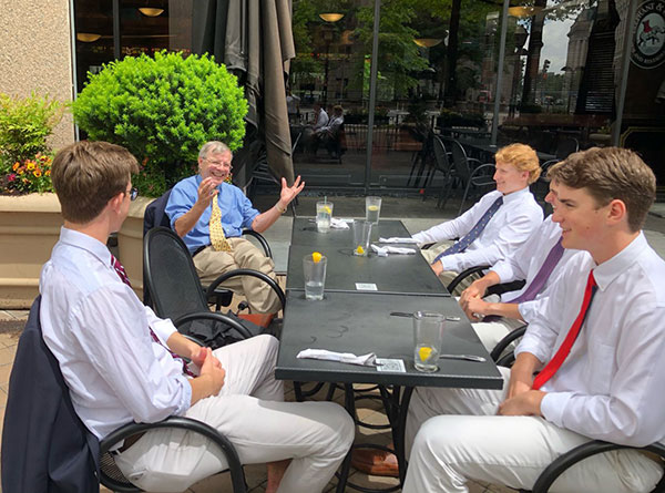 students sitting outdoors for lunch at a restaurant in DC