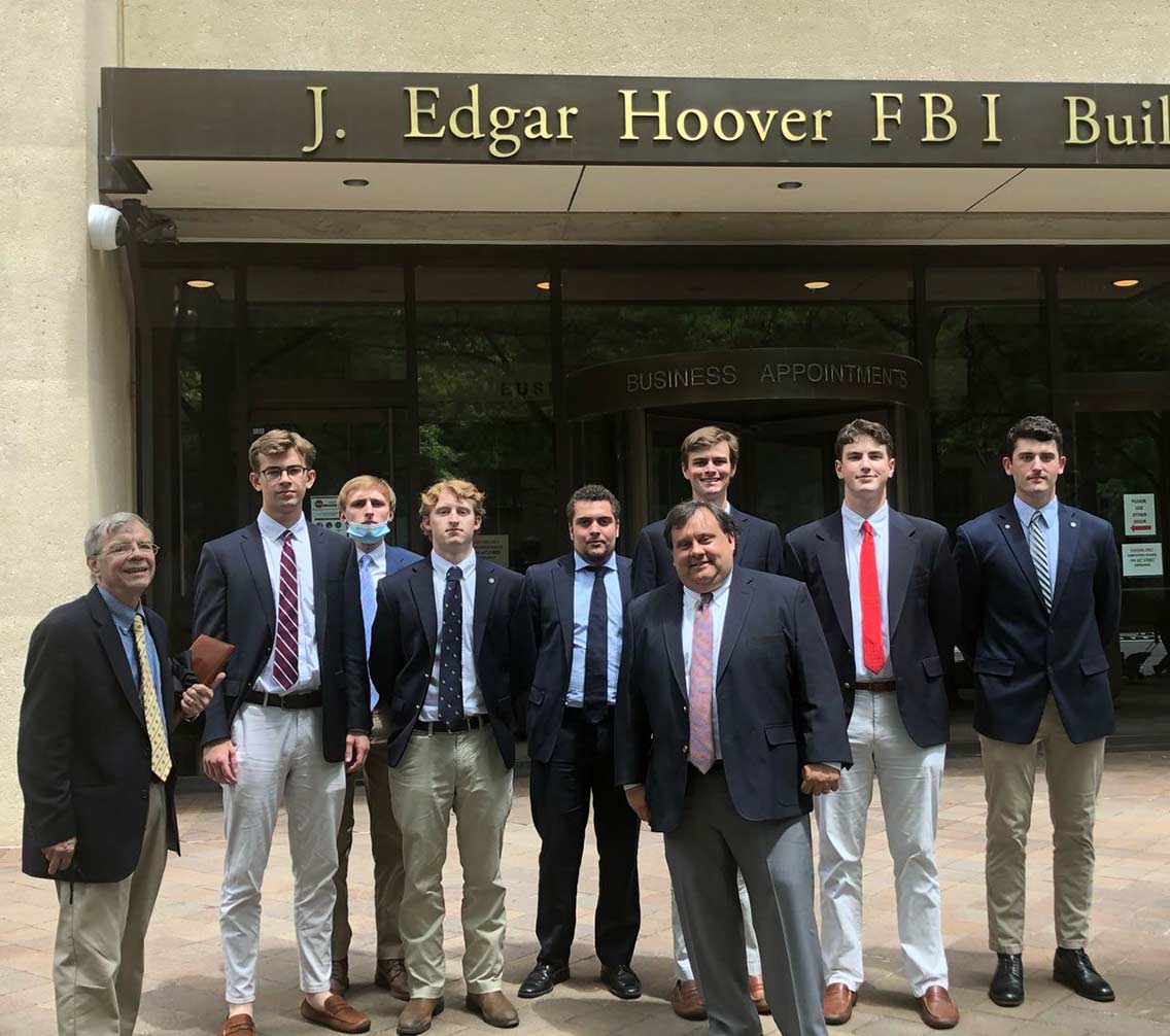 Wilson Center students standing in fron of a federal FBI building