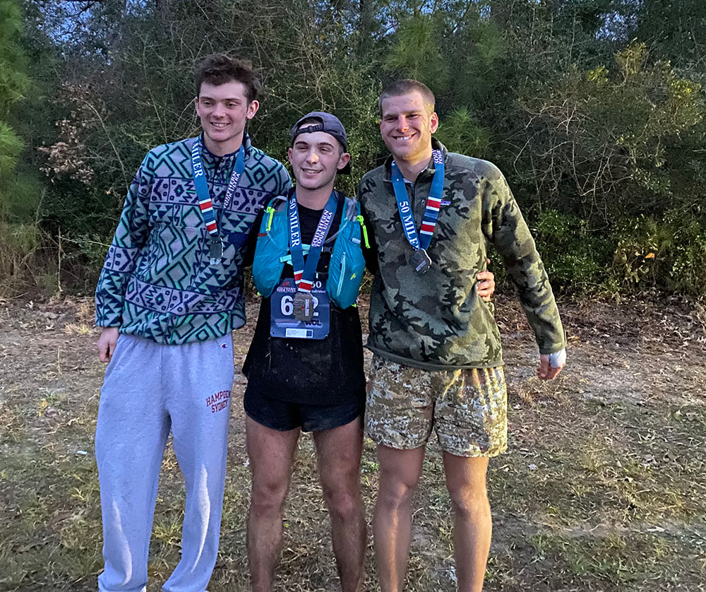 Carson Mann ’25, Greyson Hurley ’24, and James Gilbert ’23 posing after they complete an ultramarathon