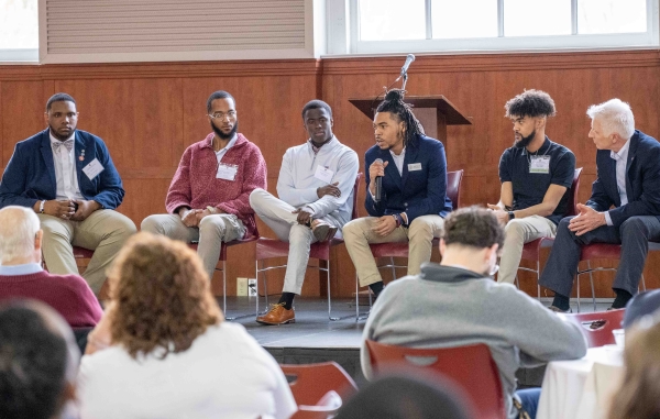 Men discussing issues on a panel at the MSU Alumni Mentorship event