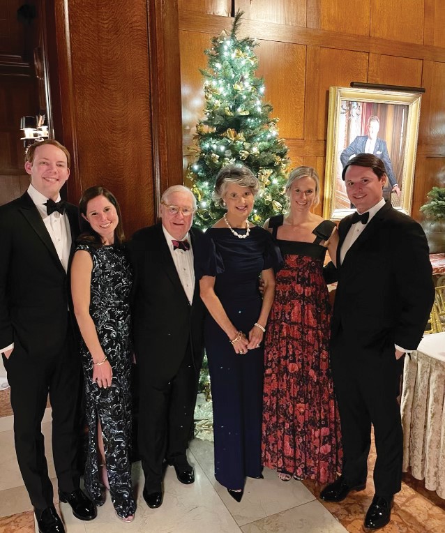 The Pitts family gathered around a Christmas tree