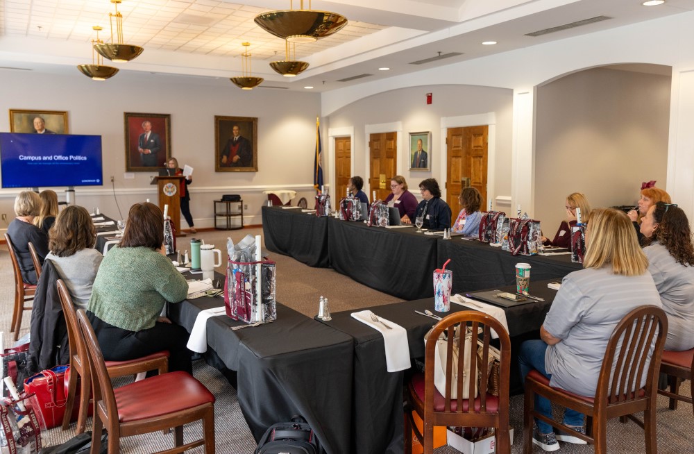 people gathered around a table in a conference room