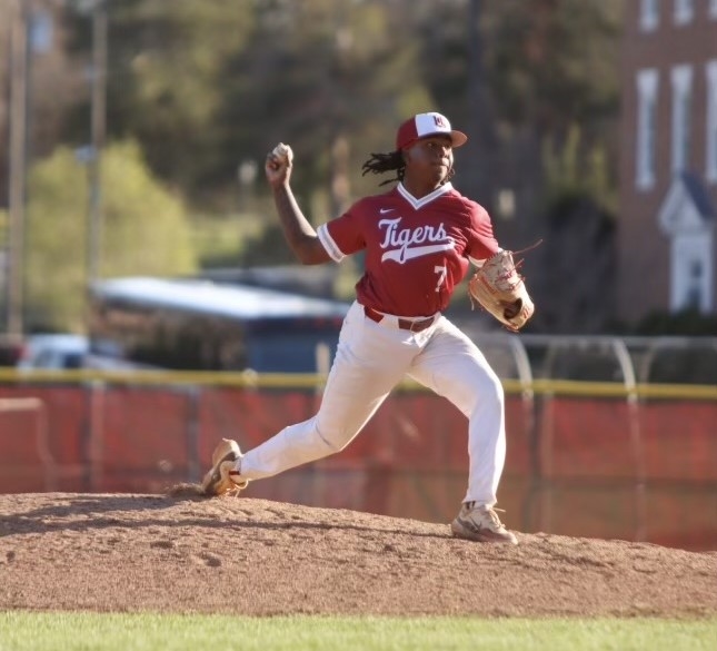 Alex Fist-Hugh pitching a baseball on the mound