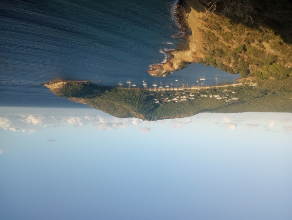 a far-away view of land from the sea