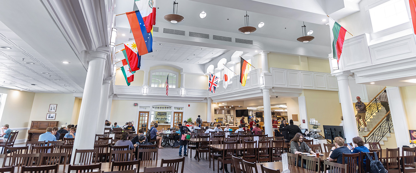 Hampden-Sydney College students eating in the large, brightly lit dining hall